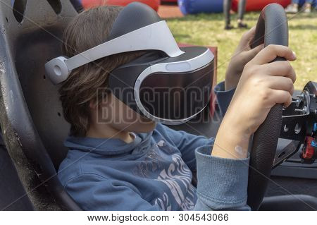 Child Wearing Vr Glasses Driving A Car