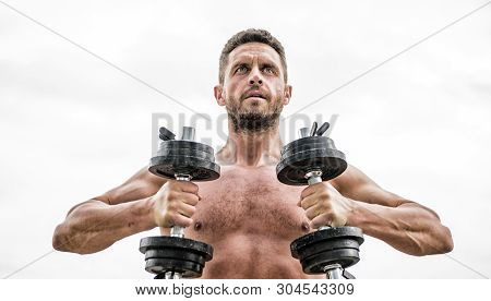 Fitness And Sport Equipment. Athletic Body. Dumbbell Gym. Man Sportsman With Strong Ab Torso. Steroi