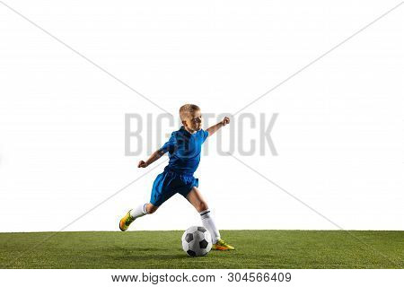 Young Boy As A Soccer Or Football Player In Sportwear Making A Feint Or A Kick With The Ball For A G