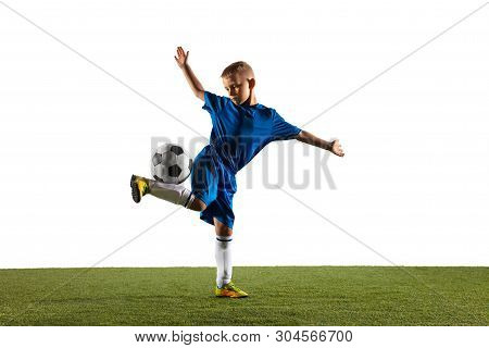 Young Boy As A Soccer Or Football Player In Sportwear Making A Feint Or A Kick With The Ball For A G