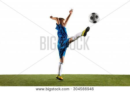 Young Boy As A Soccer Or Football Player In Sportwear Making A Feint Or A Kick With The Ball For A G