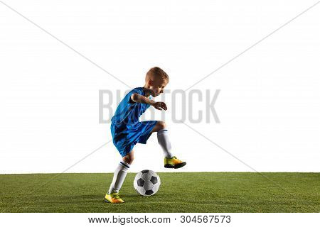 Young Boy As A Soccer Or Football Player In Sportwear Making A Feint Or A Kick With The Ball For A G