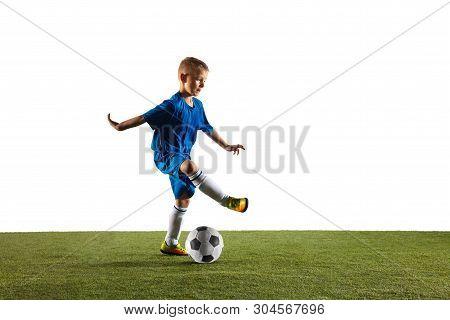Young Boy As A Soccer Or Football Player In Sportwear Making A Feint Or A Kick With The Ball For A G