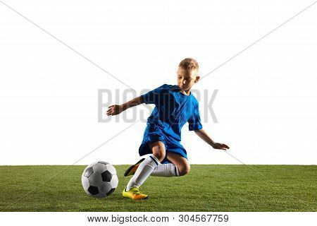 Young Boy As A Soccer Or Football Player In Sportwear Making A Feint Or A Kick With The Ball For A G