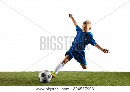 Young Boy As A Soccer Or Football Player In Sportwear Making A Feint Or A Kick With The Ball For A G