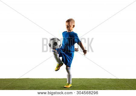 Young Boy As A Soccer Or Football Player In Sportwear Making A Feint Or A Kick With The Ball For A G