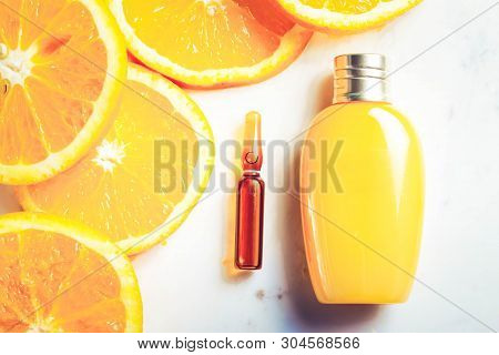 Vitamin C, Natural Anti Aging Cosmetics Cream Bottle And Serum Ampula With Fruits, Toned