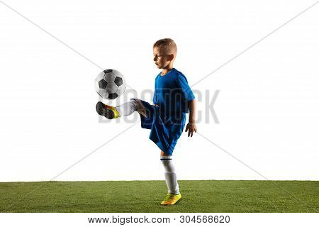 Young Boy As A Soccer Or Football Player In Sportwear Making A Feint Or A Kick With The Ball For A G