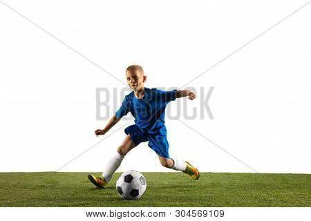 Young Boy As A Soccer Or Football Player In Sportwear Making A Feint Or A Kick With The Ball For A G