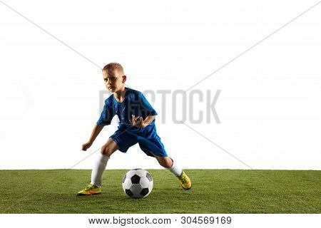 Young Boy As A Soccer Or Football Player In Sportwear Making A Feint Or A Kick With The Ball For A G