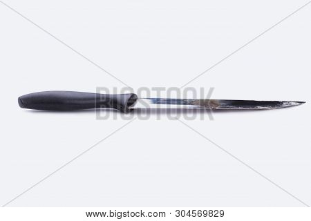 Rusty Old Knife With Black Rubber Handle. Used Knife Isolated On White Background. Space For Text.