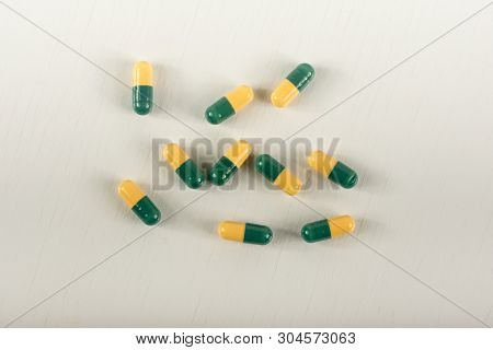 Green, Yellow Tramadol Capsule Pills On White Background.pain Killer Capsules Called 