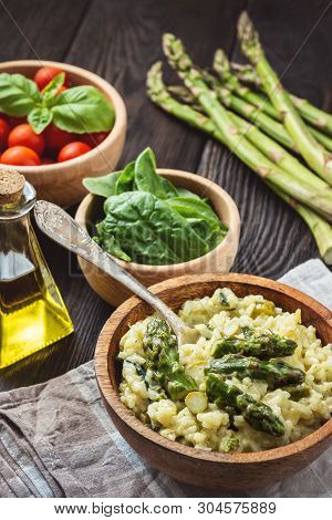 Asparagus And Spinach Risotto , Italian Cuisine, On Dark Background.