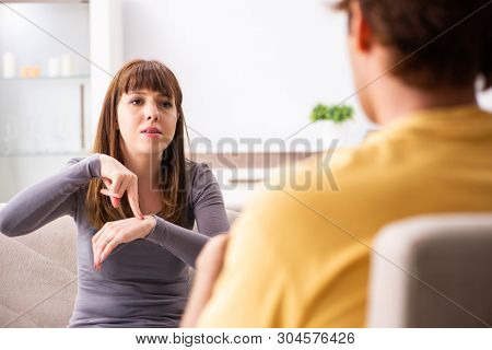 Woman and man learning sign language