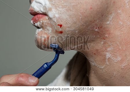 Disposable Razor. Man Is Shaving. Shaving By Yourself Painful And Unpleasant. Inconvenience Of Home 