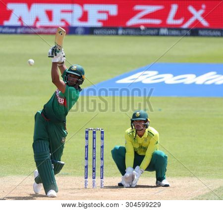 LONDON, ENGLAND. 02 JUNE 2019: Shakib Al Hasan of Bangladesh plays a shot as wicketkeeper Quinton de Kock of South Africa looks on during the South Africa v Bangladesh, ICC Cricket World Cup match
