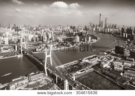Shanghai Nanpu Bridge over Huangpu River with busy traffic in China.