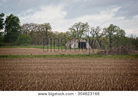 This Is An Old Shed In A Remote Part Of A Field Early In The Spring.