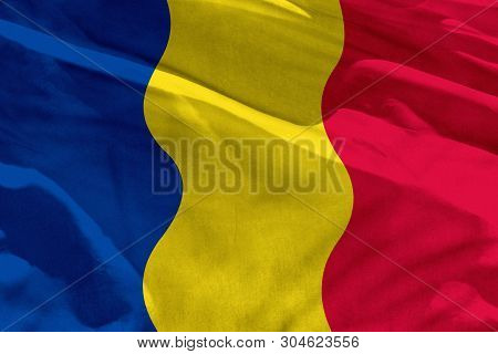 Fluttering Romania Flag For Using As Texture Or Background, The Flag Is Waving On The Wind