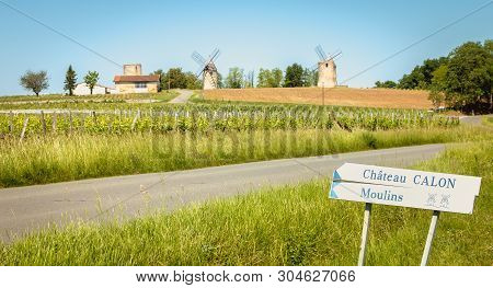 Calon Near Bordeaux, France - May 26, 2017: Calon Castle Sign And Sign French Windmills Roadside On 