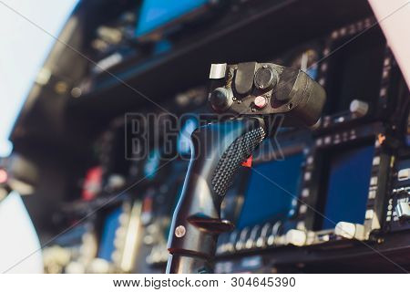 Black Control Panel In A Helicopter Cockpit.