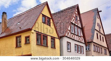 Traditional German Architecture. Top Of Ancient Half-timbered Housse In A Medieval Old Town. Germany