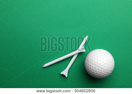Golf Ball And Tees On Color Background, Flat Lay. Space For Text