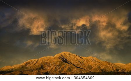 Sunset With Warm Clouds Crowning The Sky.