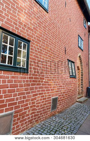 Pregnant House Or Das Schwangere Haus With Deformed Brick Wall In Luneburg. Germany