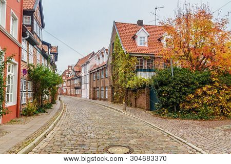 Street With Medieval Old Brick Buildings In Luneburg. Germany