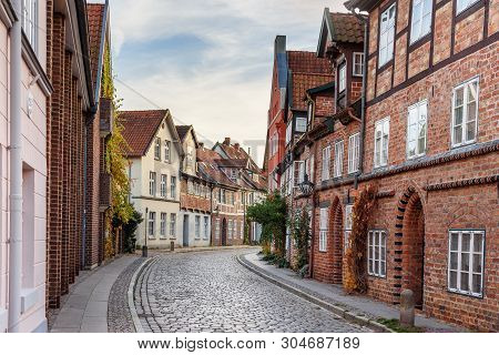 Street With Medieval Old Brick Buildings In Luneburg. Germany