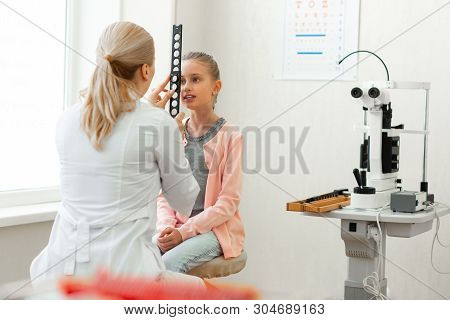 Blonde Professional Doctor In White Robe Discovering Her New Patient