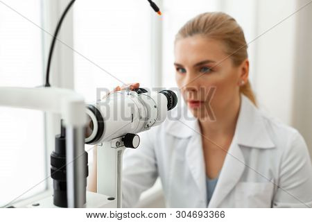Accurate Blonde Doctor Setting Her Apparatus In Comfortable Position