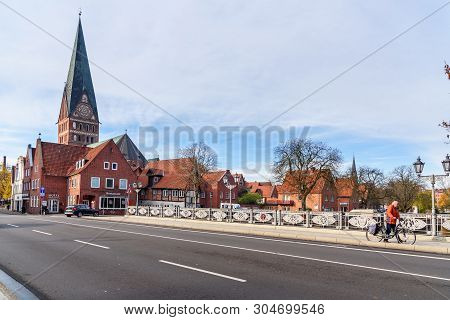 Luneburg, Germany - November 06, 2018: View Of Cathedral And Old Historical Houses From Bridge Over 