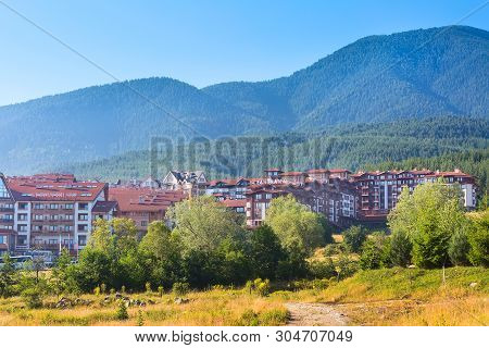 Bansko, Bulgaria - June 13, 2017: St Ivan Rilski And Panorama Hotel Houses And Summer Mountains Pano