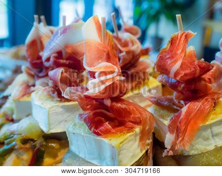 Typical Spanish Tapa Of Iberic Ham And Cheese. Food In Spanish Bars