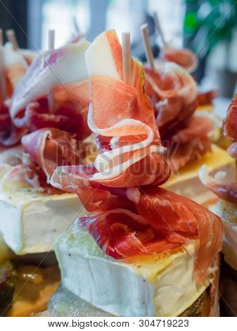 Typical Spanish Tapa Of Iberic Ham And Cheese. Food In Spanish Bars