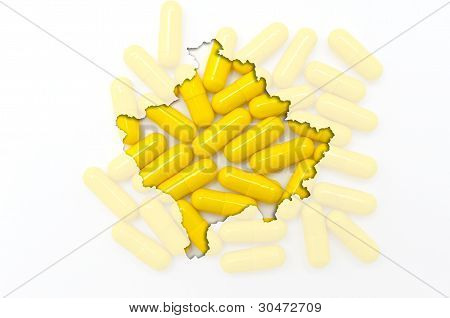 Kontur kort over Kosovo med piller i baggrunden For sundhed og helbredelse