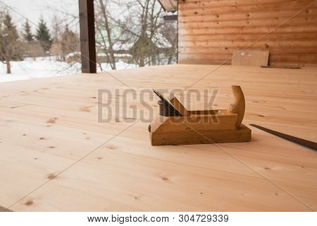 Jointer And Saw. Old Wooden Jointer Carpenter Tool And Metal Saw On Wooden Background