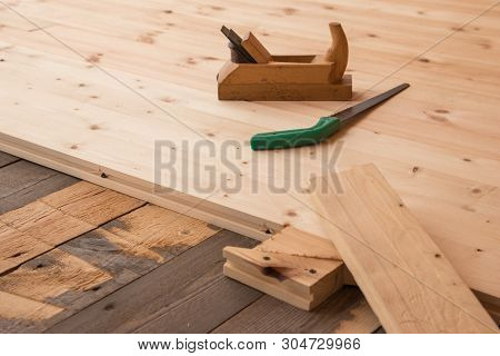 Jointer And Saw. Old Wooden Jointer Carpenter Tool And Metal Saw On Wooden Background