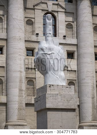 Milan, Italy - May 25, 2019: Middle Finger Sculpture And Mezzanotte Palace Facade In Milan Stock Exc
