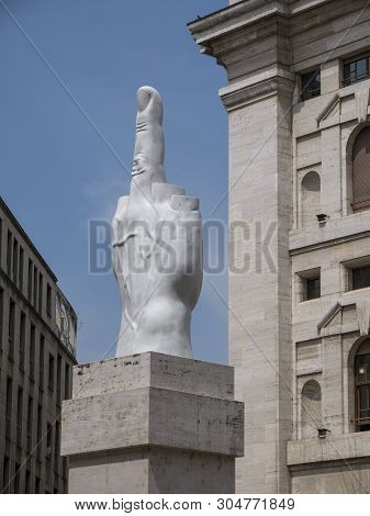 Milan, Italy - May 25, 2019: Middle Finger Sculpture And Mezzanotte Palace Facade In Milan Stock Exc