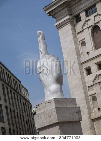 Milan, Italy - May 25, 2019: Middle Finger Sculpture And Mezzanotte Palace Facade In Milan Stock Exc
