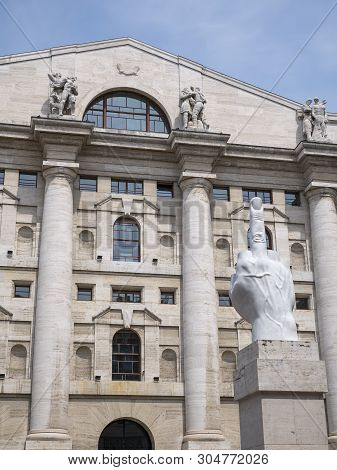 Milan, Italy - May 25, 2019: Mezzanotte Palace Facade And Middle Finger Sculpture In Milan Stock Exc