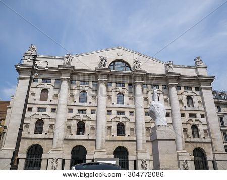 Milan, Italy - May 25, 2019: Mezzanotte Palace Facade And Middle Finger Sculpture In Milan Stock Exc