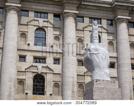 Milan, Italy - May 25, 2019: Mezzanotte Palace Facade And Middle Finger Sculpture In Milan Stock Exc