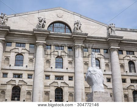 Milan, Italy - May 25, 2019: Mezzanotte Palace Facade And Middle Finger Sculpture In Milan Stock Exc