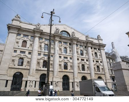 Milan, Italy - May 25, 2019: Mezzanotte Palace Facade And Middle Finger Sculpture In Milan Stock Exc