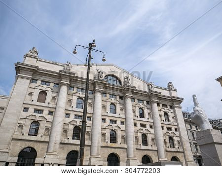 Milan, Italy - May 25, 2019: Mezzanotte Palace Facade And Middle Finger Sculpture In Milan Stock Exc