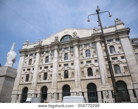 Milan, Italy - May 25, 2019: Mezzanotte Palace Facade And Middle Finger Sculpture In Milan Stock Exc